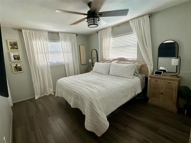 a bedroom with furniture and a window