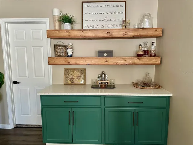 a bedroom with a bed and lamp