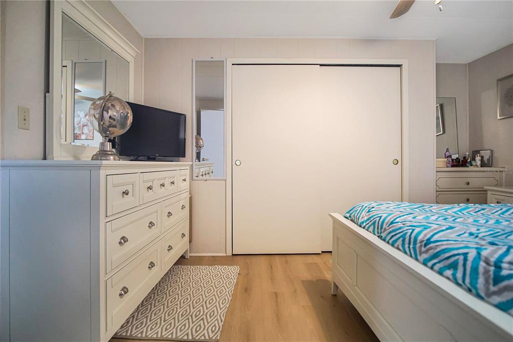 251 Patterson Road, Unit C13 Haines City, FL 33844 - Photo 12 of 28 a bedroom with a bed and a dresser in it