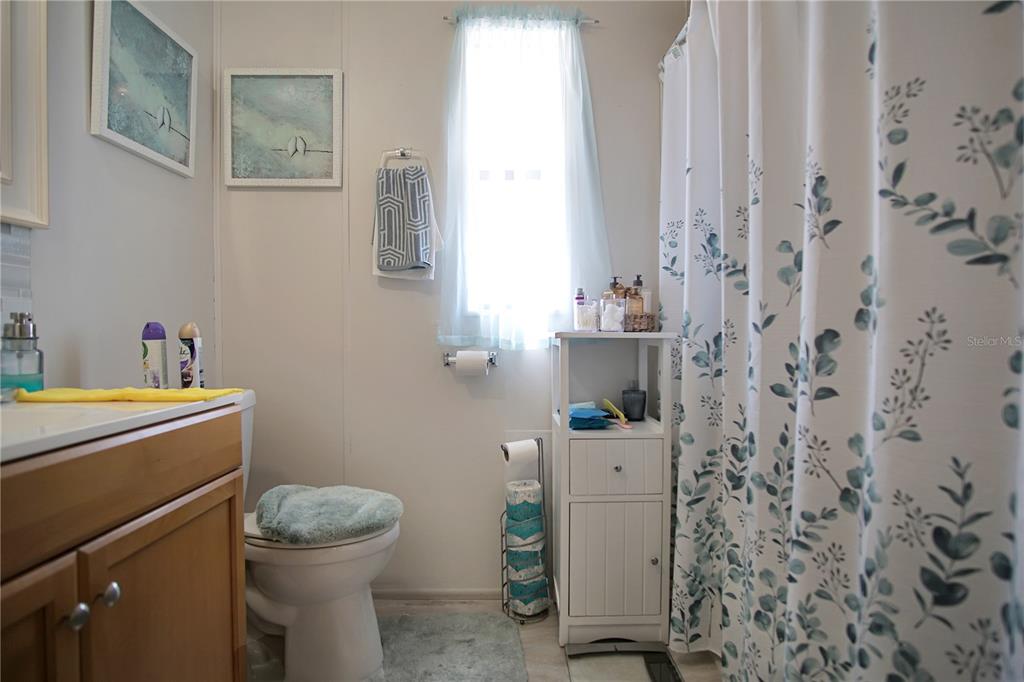 251 Patterson Road, Unit C13 Haines City, FL 33844 - Photo 13 of 28 a bathroom with a toilet and a sink