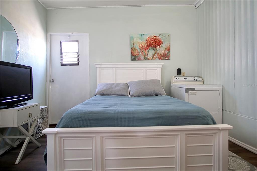 251 Patterson Road, Unit C13 Haines City, FL 33844 - Photo 14 of 28 a bedroom with a bed and a flat screen tv