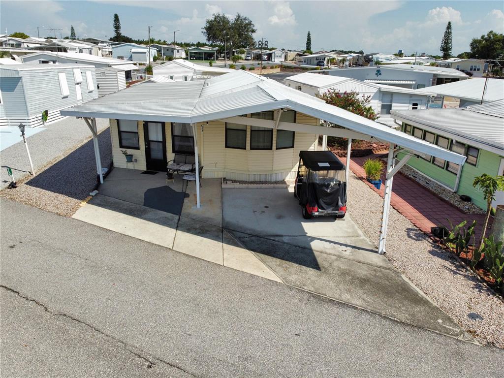 251 Patterson Road, Unit C13 Haines City, FL 33844 - Photo 2 of 28 a terrace with a table and chairs