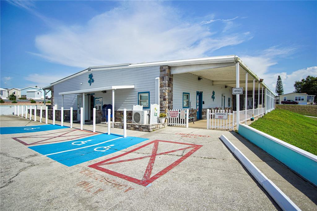 251 Patterson Road, Unit C13 Haines City, FL 33844 - Photo 24 of 28 a view of swimming pool with lawn chairs and large trees