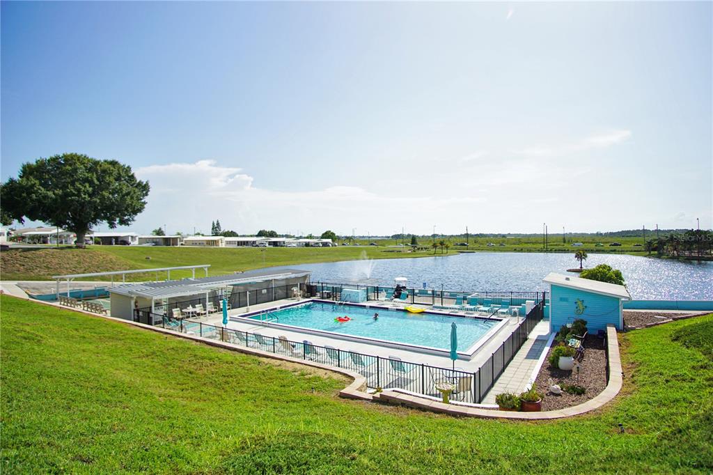 251 Patterson Road, Unit C13 Haines City, FL 33844 - Photo 25 of 28 a view of swimming pool with outdoor seating and yard