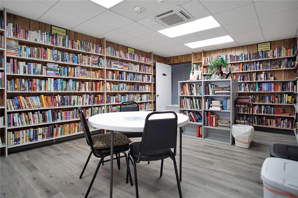 251 Patterson Road, Unit C13 Haines City, FL 33844 - Photo 26 of 28 a view of a livingroom with furniture and a bookshelf