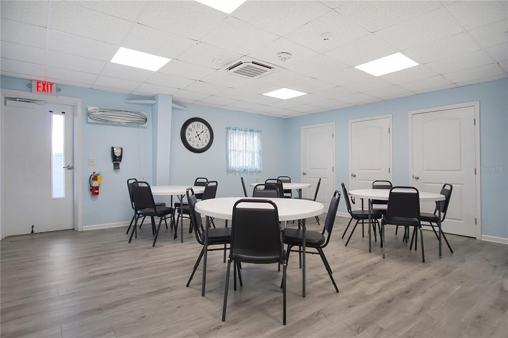 251 Patterson Road, Unit C13 Haines City, FL 33844 - Photo 28 of 28 a view of a dining room with furniture and wooden floor