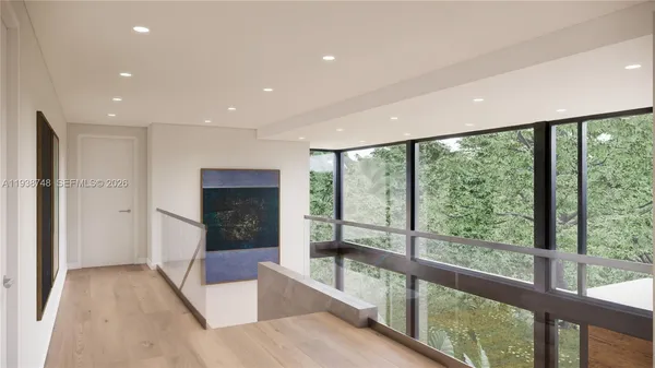 a view of hallway with a large window and yard