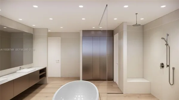 a bathroom with a tub and a shower