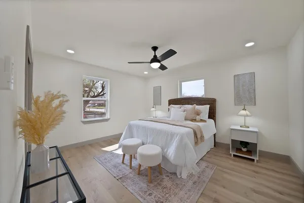 a bed room with a bed and a chair