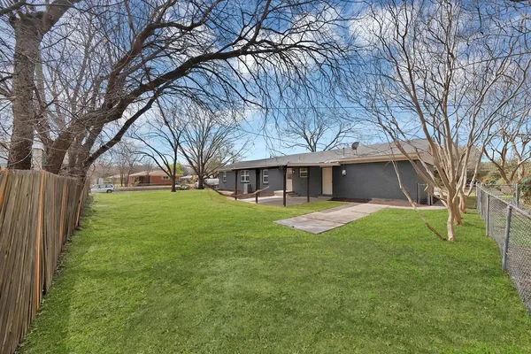 a view of a house with a back yard