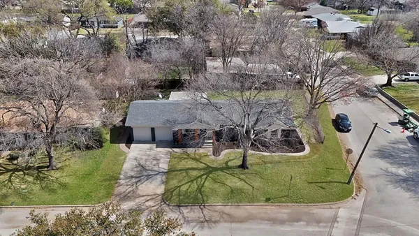 an aerial view of a house with garden