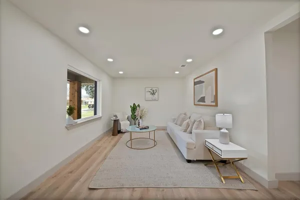 a living room with furniture and a window