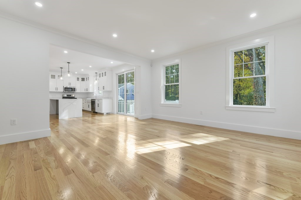 30 Oscars Way Dedham, MA 02026 - Photo 11 of 39 a view of a living room and kitchen