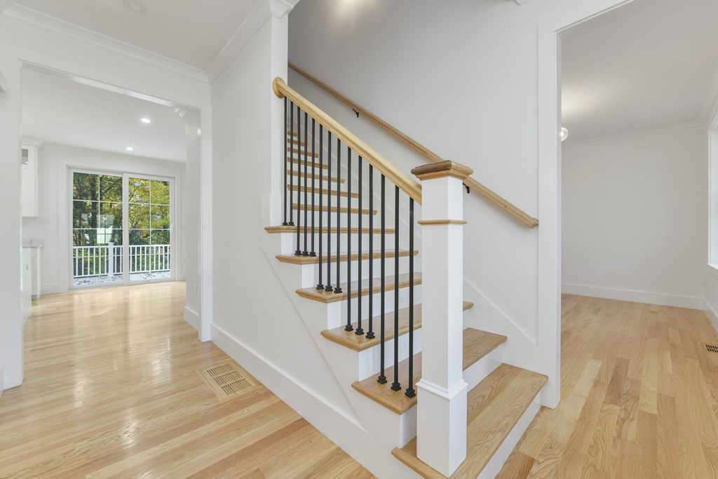 30 Oscars Way Dedham, MA 02026 - Photo 16 of 39 a view of entryway and hall with wooden floor