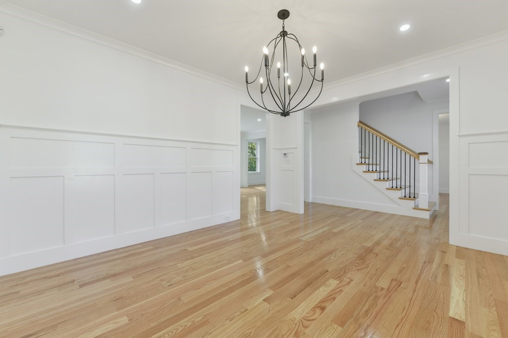 30 Oscars Way Dedham, MA 02026 - Photo 17 of 39 a view of empty room with wooden floor