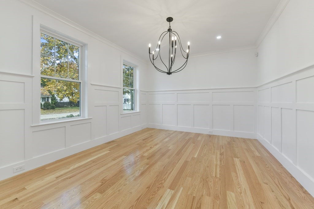 30 Oscars Way Dedham, MA 02026 - Photo 18 of 39 a view of a room with wooden floor and windows