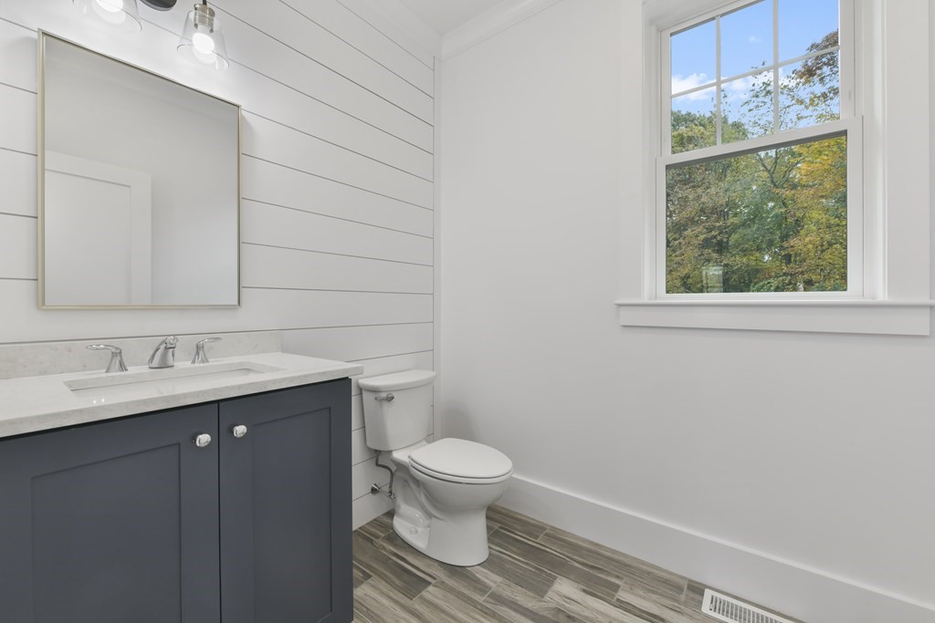 30 Oscars Way Dedham, MA 02026 - Photo 20 of 39 a bathroom with a granite countertop sink toilet and a mirror