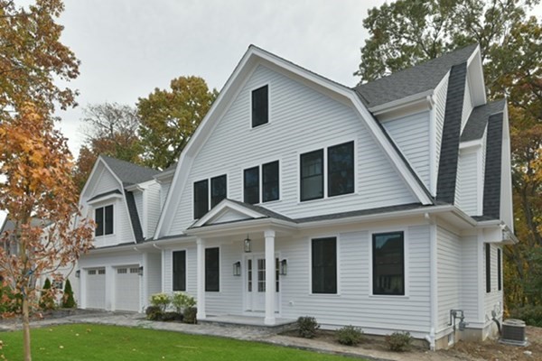 30 Oscars Way Dedham, MA 02026 - Photo 2 of 39 a front view of a house with garden