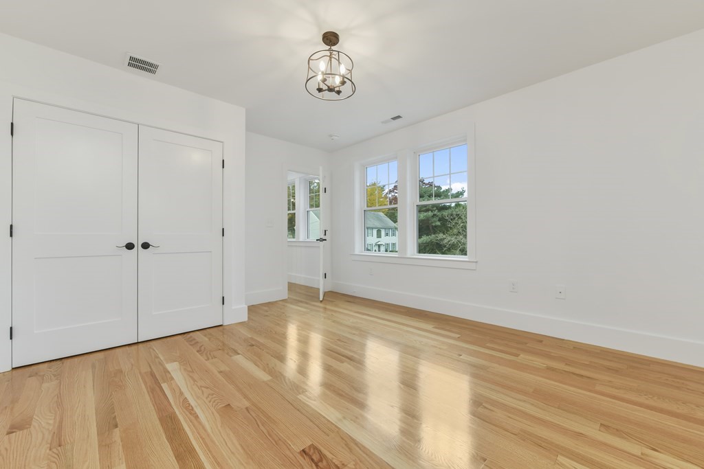 30 Oscars Way Dedham, MA 02026 - Photo 24 of 39 a view of an empty room with a window
