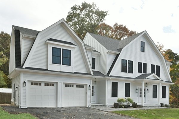 30 Oscars Way Dedham, MA 02026 - Photo 3 of 39 a front view of a house with garden