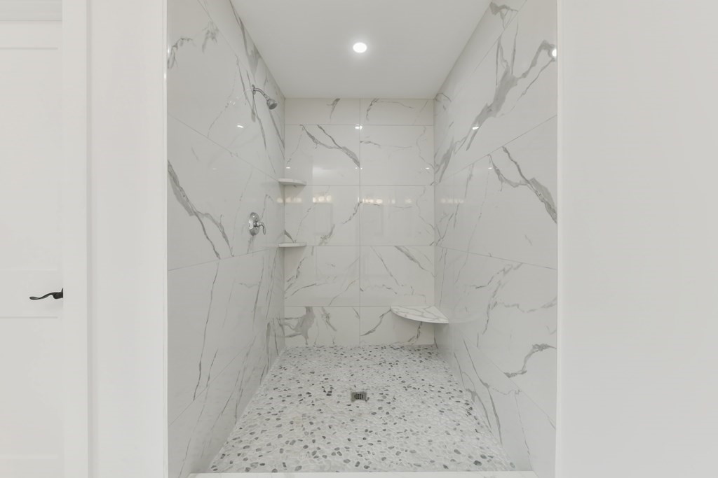 30 Oscars Way Dedham, MA 02026 - Photo 31 of 39 a bathroom with a toilet and a shower