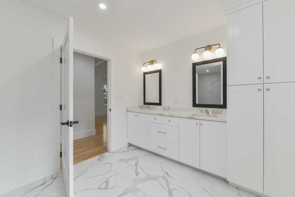 30 Oscars Way Dedham, MA 02026 - Photo 32 of 39 a spacious bathroom with 2 sink and a mirror