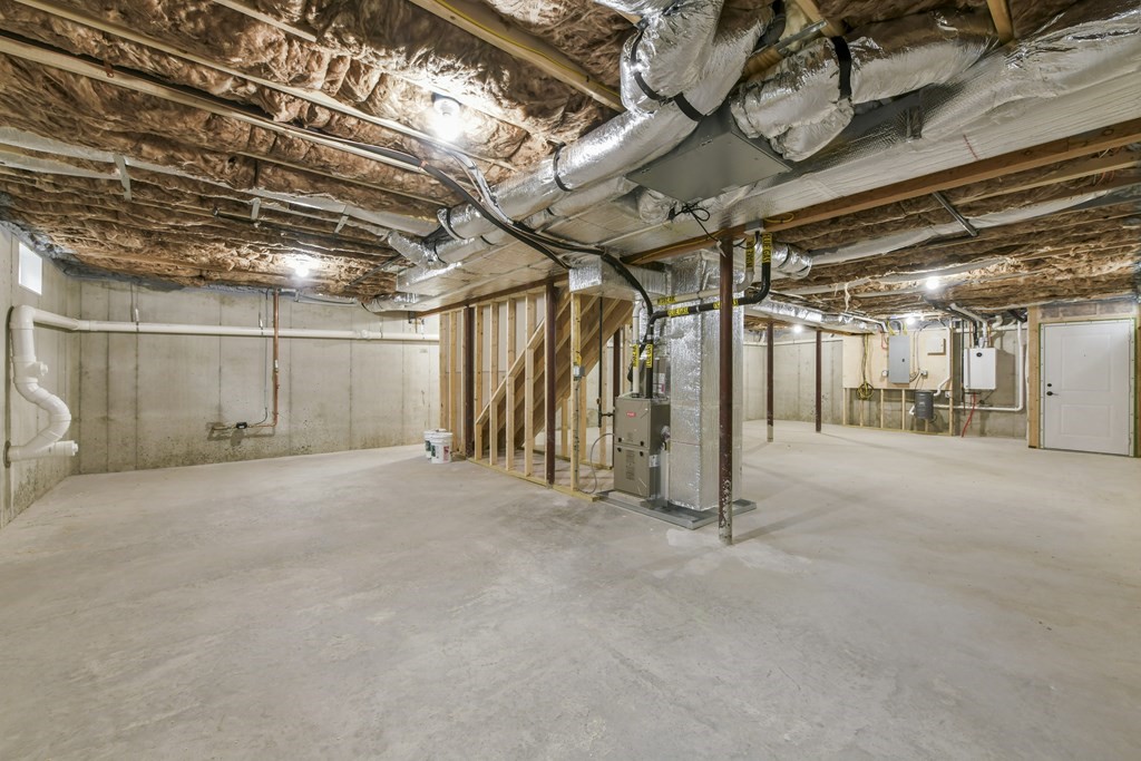 30 Oscars Way Dedham, MA 02026 - Photo 38 of 39 a view of empty room with wooden ceiling