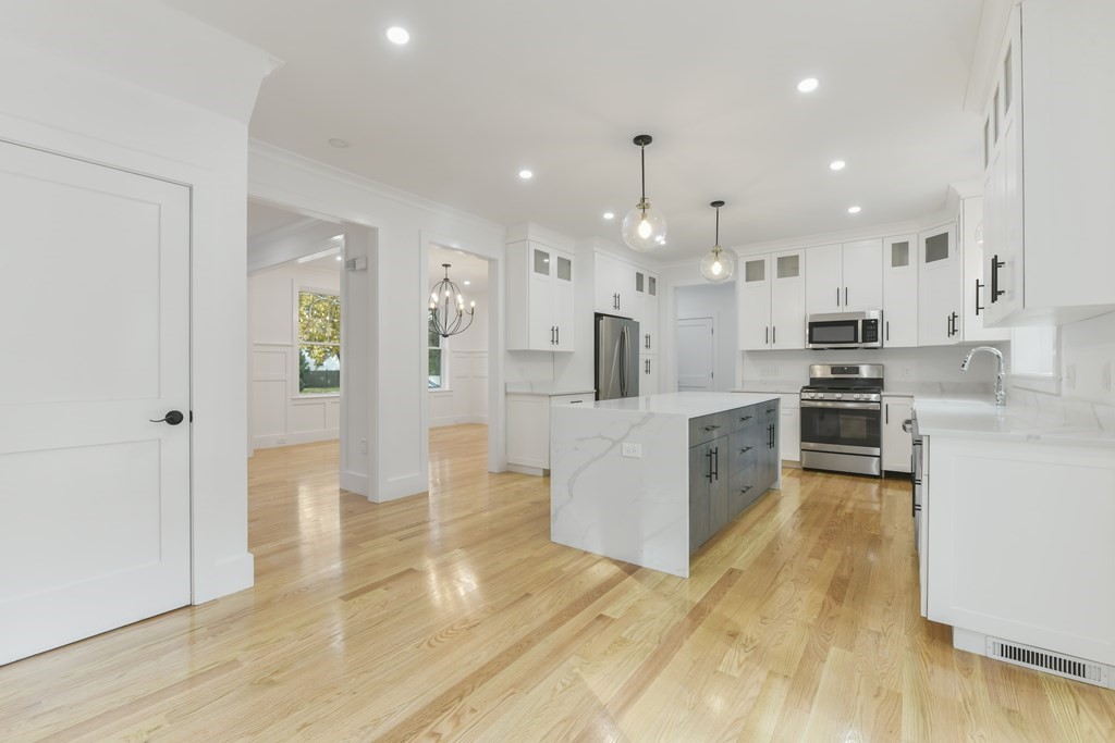 30 Oscars Way Dedham, MA 02026 - Photo 8 of 39 a view of kitchen with sink and refrigerator