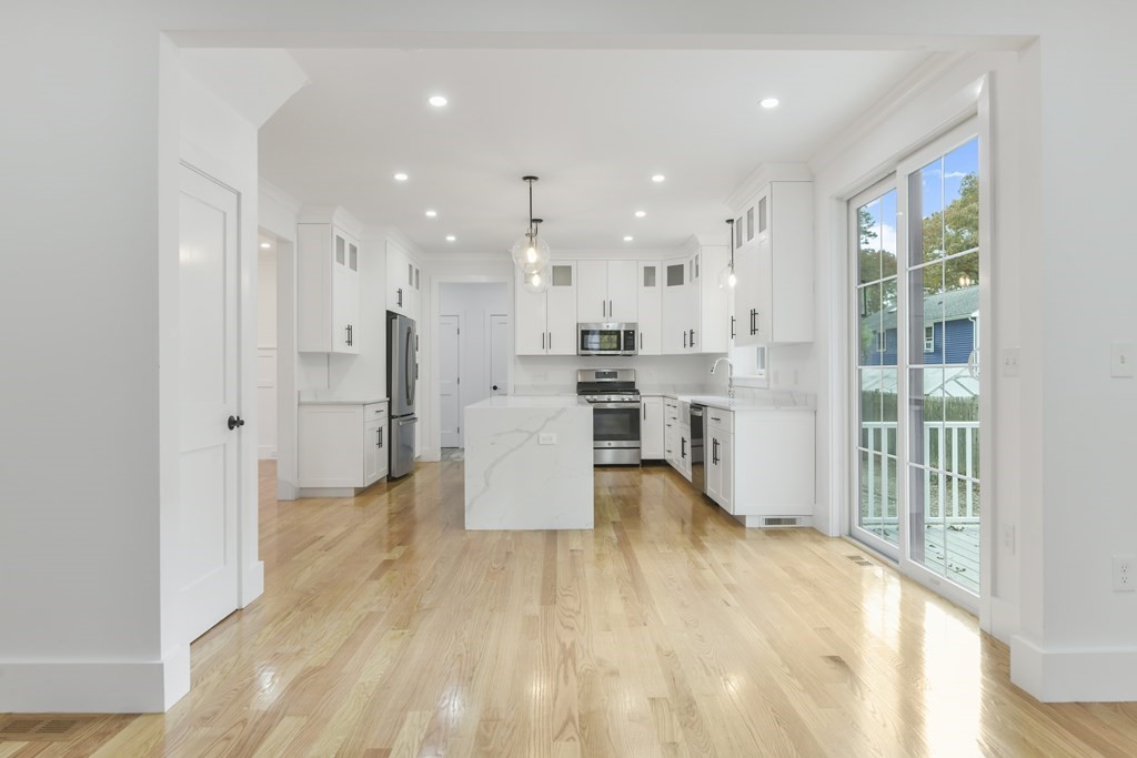 30 Oscars Way Dedham, MA 02026 - Photo 9 of 39 a view of kitchen with wooden floor