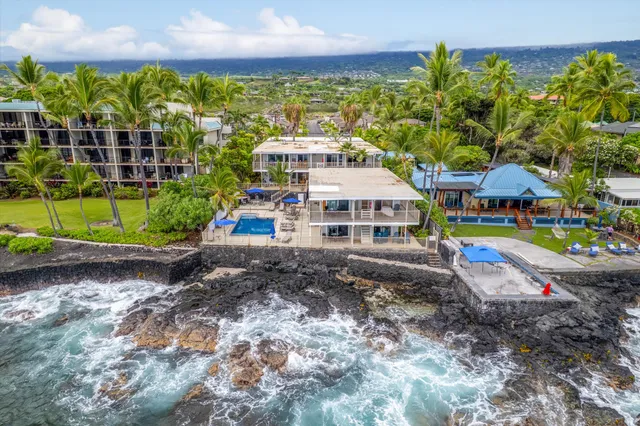 a view of multiple houses with a yard
