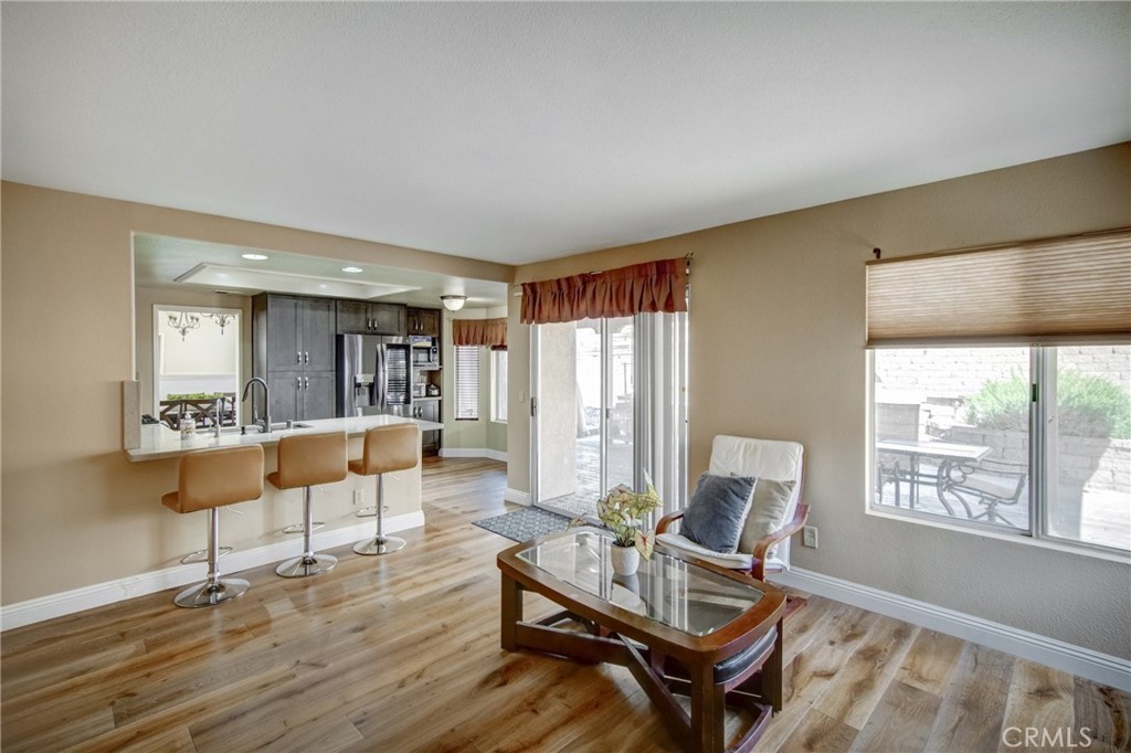 21182 Tennyson Road Moreno Valley, CA 92557 - Photo 16 of 36 a living room with furniture and a wooden floor