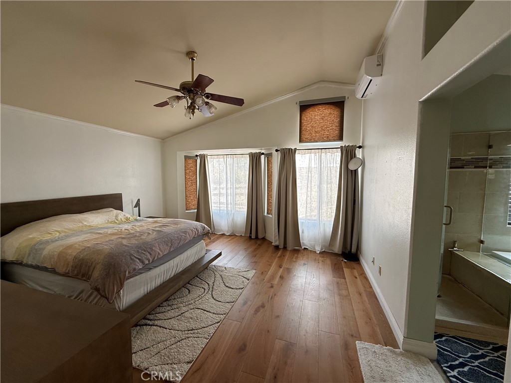 21182 Tennyson Road Moreno Valley, CA 92557 - Photo 19 of 36 a bedroom with a bed and a window