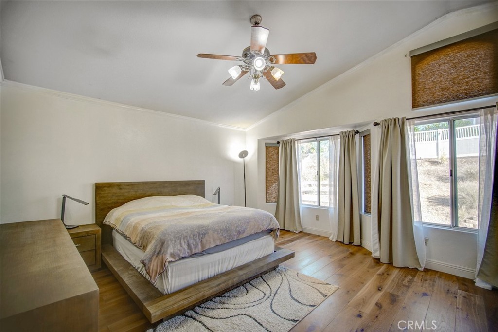 21182 Tennyson Road Moreno Valley, CA 92557 - Photo 21 of 36 a bedroom with a large bed and a window