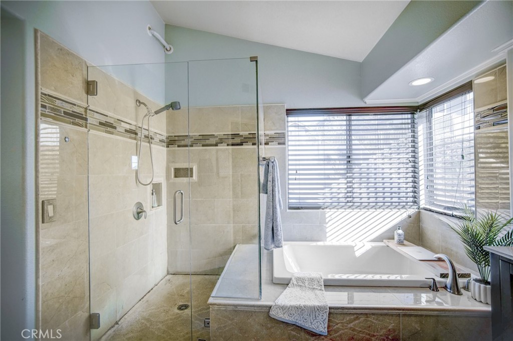 21182 Tennyson Road Moreno Valley, CA 92557 - Photo 22 of 36 a bathroom with a tub and shower