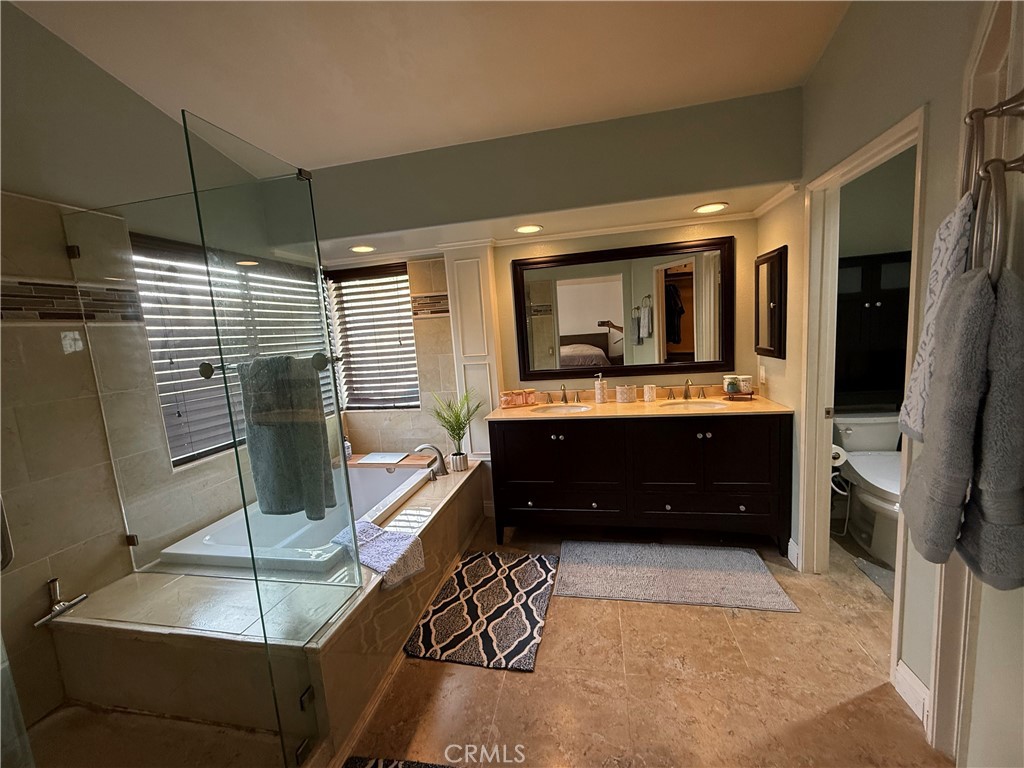 21182 Tennyson Road Moreno Valley, CA 92557 - Photo 23 of 36 a living room with a couch a dining table and chairs