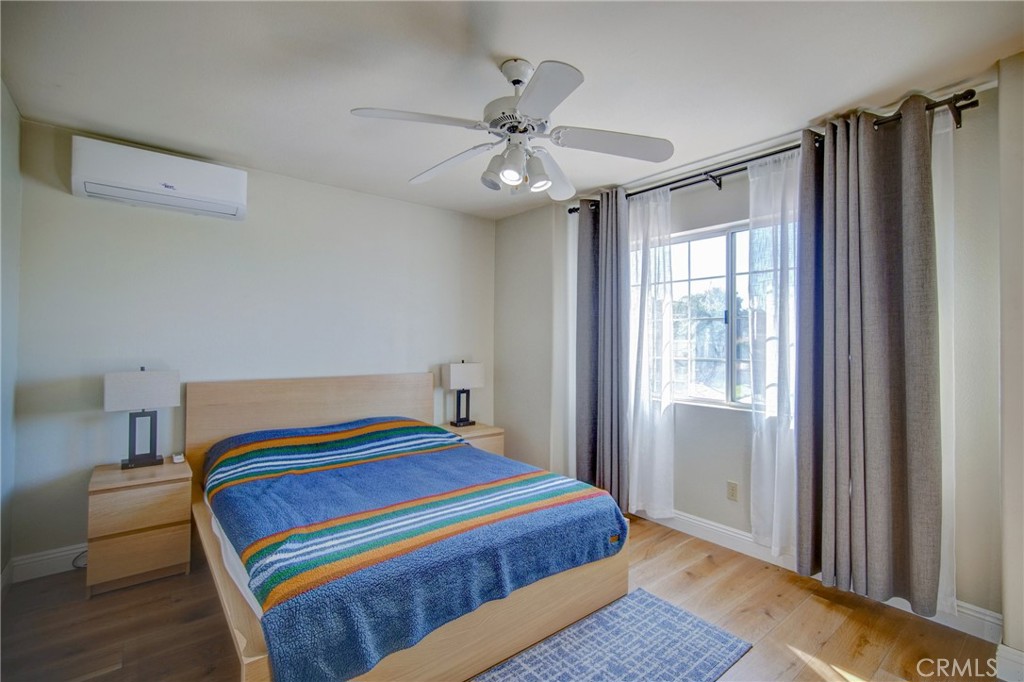 21182 Tennyson Road Moreno Valley, CA 92557 - Photo 24 of 36 a bedroom with a bed and a window