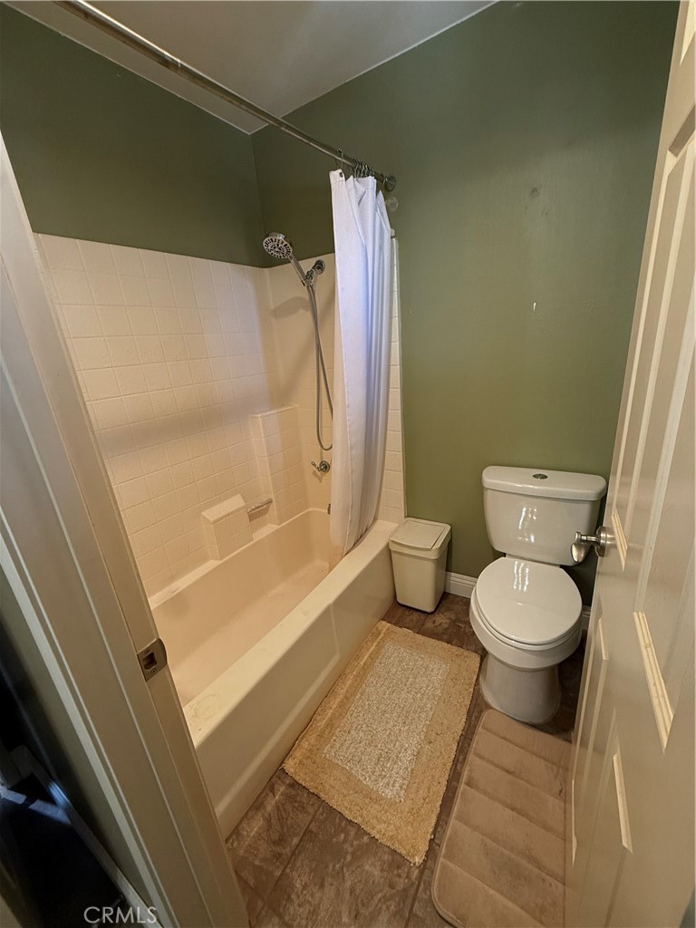 21182 Tennyson Road Moreno Valley, CA 92557 - Photo 26 of 36 a bathroom with a toilet and a shower