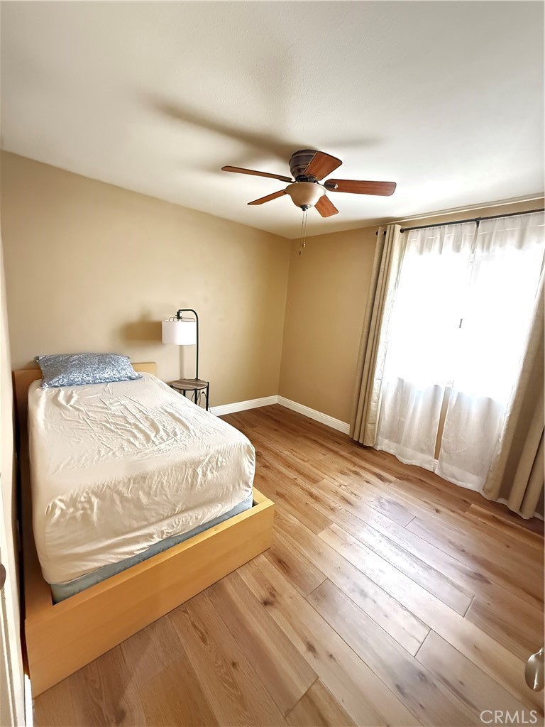 21182 Tennyson Road Moreno Valley, CA 92557 - Photo 27 of 36 a bedroom with a bed and a window