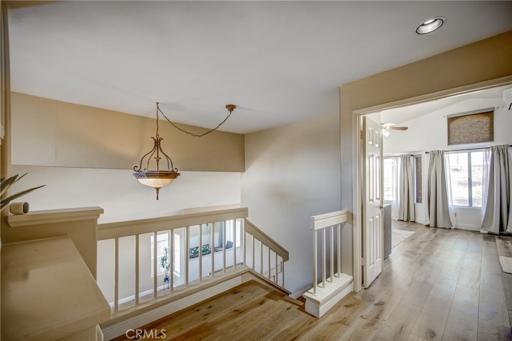 21182 Tennyson Road Moreno Valley, CA 92557 - Photo 29 of 36 a view of a livingroom with wooden floor and stairs