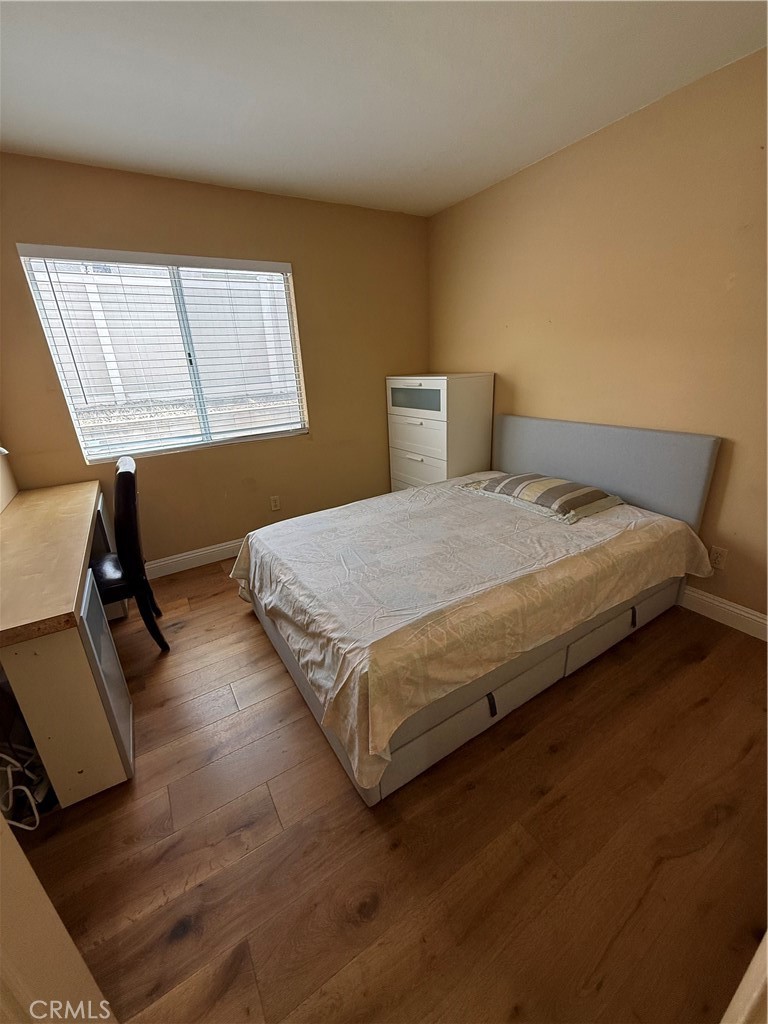 21182 Tennyson Road Moreno Valley, CA 92557 - Photo 30 of 36 a bedroom with a bed and window