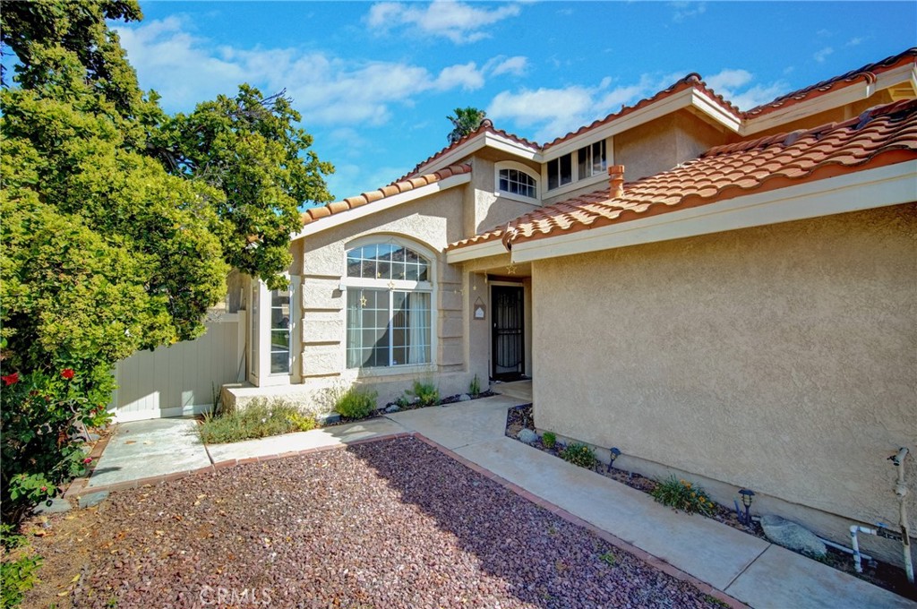 21182 Tennyson Road Moreno Valley, CA 92557 - Photo 3 of 36 a front view of a house with garden