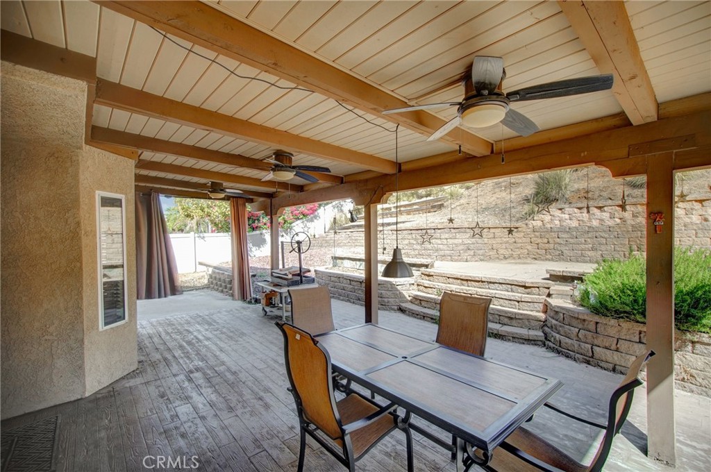 21182 Tennyson Road Moreno Valley, CA 92557 - Photo 33 of 36 a view of a patio with table and chairs and potted plants