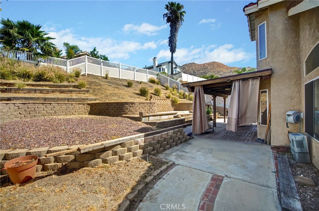 21182 Tennyson Road Moreno Valley, CA 92557 - Photo 34 of 36 a view of a house with a outdoor space