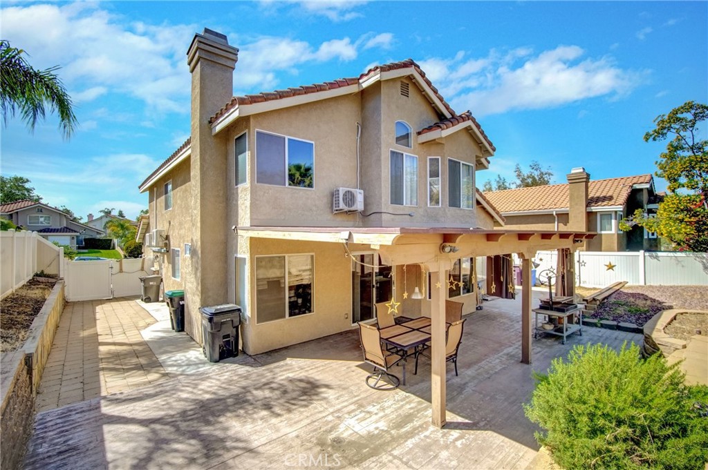 21182 Tennyson Road Moreno Valley, CA 92557 - Photo 35 of 36 a view of a house with backyard porch and sitting area