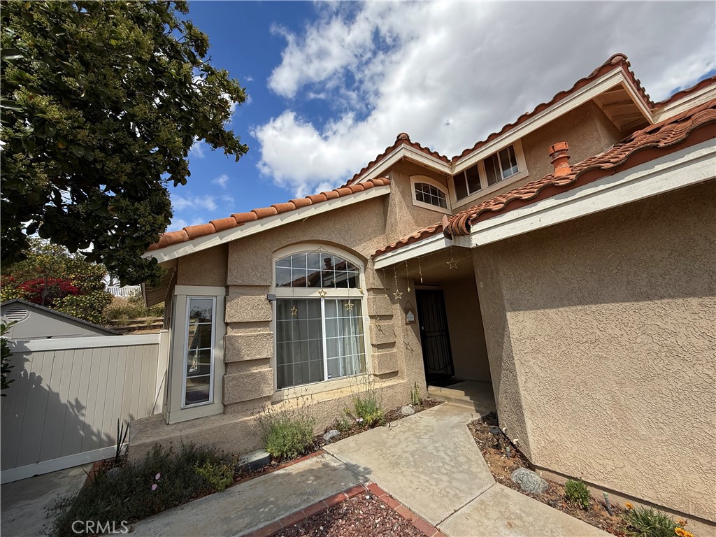 21182 Tennyson Road Moreno Valley, CA 92557 - Photo 5 of 36 a front view of a house with plants