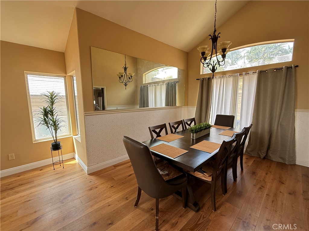 21182 Tennyson Road Moreno Valley, CA 92557 - Photo 10 of 36 a view of a dining room with furniture window and wooden floor