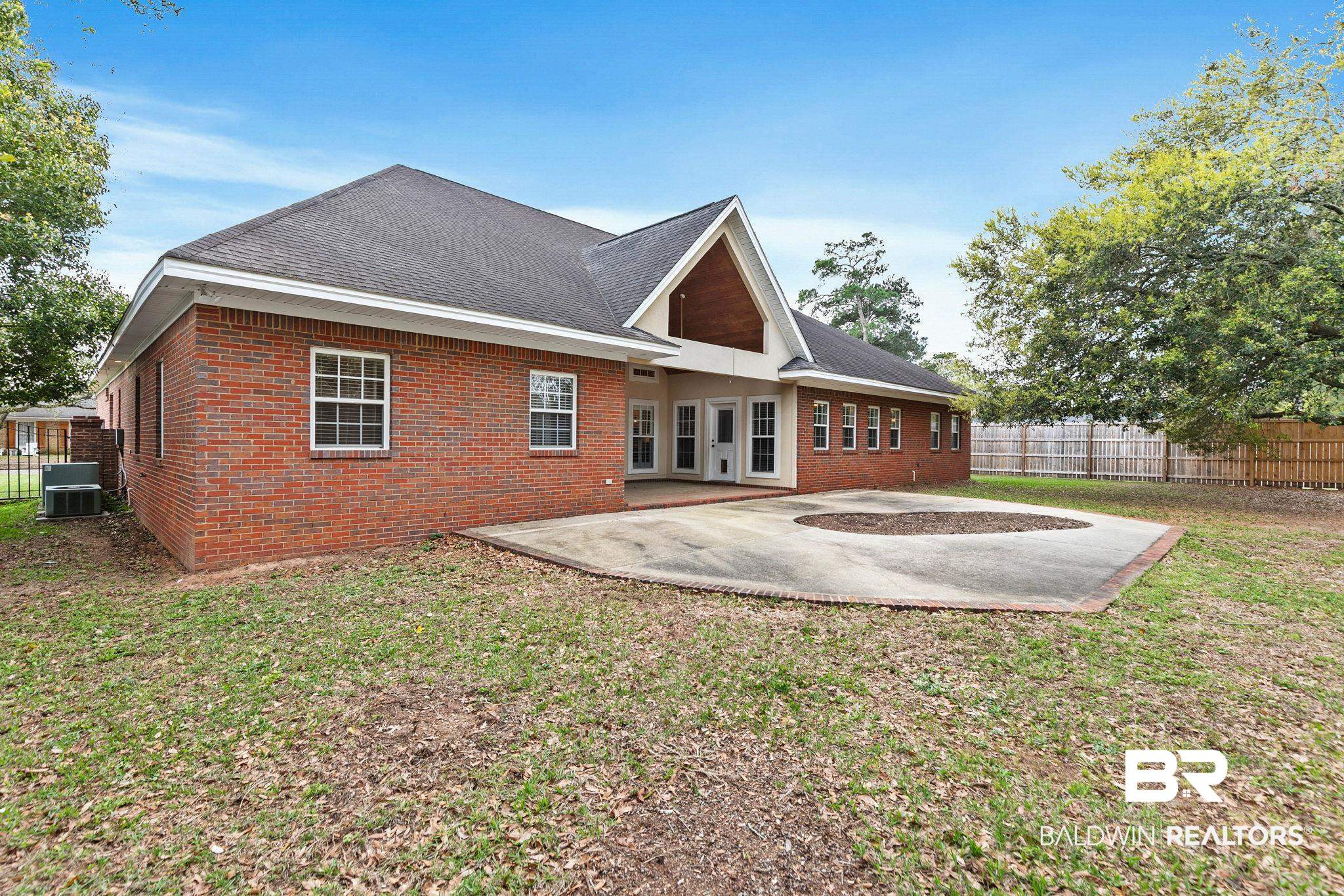 3668 Claridge Road North Mobile, AL 36608 - Photo 90 of 100 Rear view of property with a patio area, brick siding, and roof with shingles