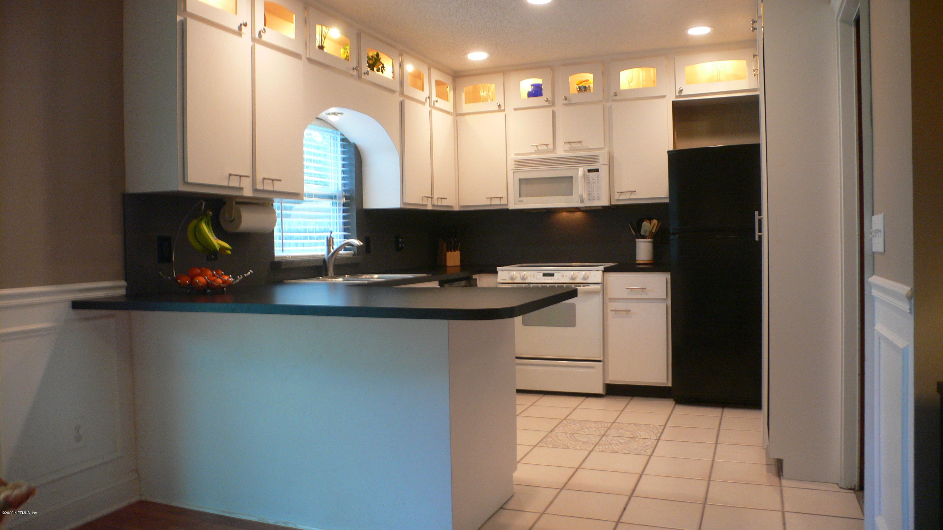 12779 Attrill Road Jacksonville, FL 32258 - Photo 2 of 11 a kitchen with a sink cabinets and appliances