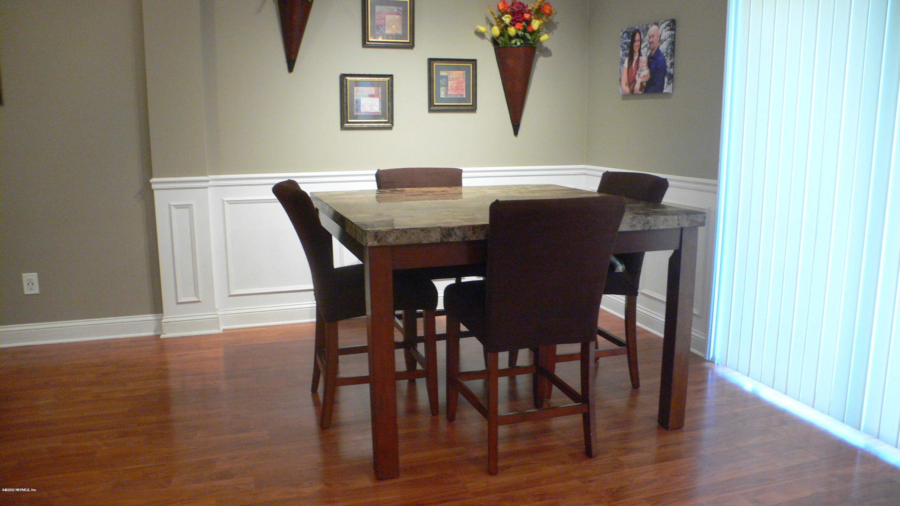 12779 Attrill Road Jacksonville, FL 32258 - Photo 4 of 11 a view of a dining room with furniture and wooden floor