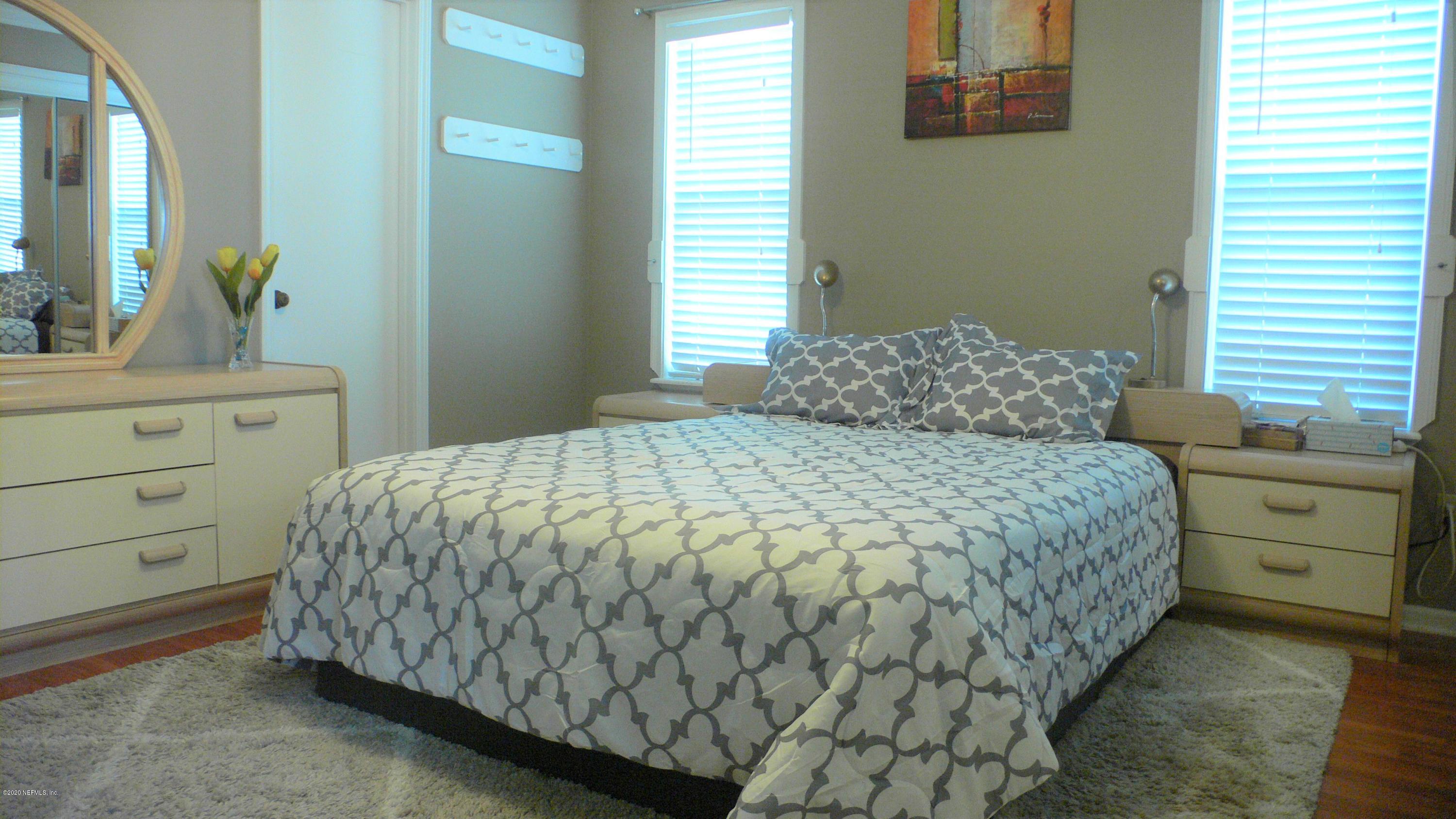 12779 Attrill Road Jacksonville, FL 32258 - Photo 6 of 11 a bedroom with a bed and a dresser